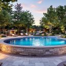 Creative Poolside Landscaping Ideas with Decorative Stone Borders and Pathways